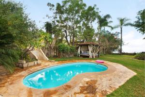 a swimming pool in a yard with a gazebo at Casa Anakena in Guía de Isora