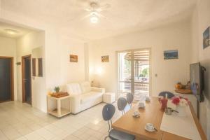 a living room with a couch and a table and chairs at Silva in Campese