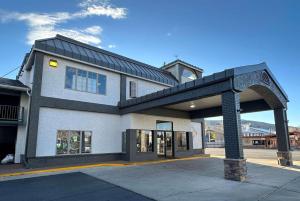 a building with a black roof on a street at Wingate by Wyndham Gunnison Near Western Colorado University in Gunnison