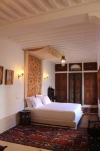 Postel nebo postele na pokoji v ubytování Riad El Morocco Hotel