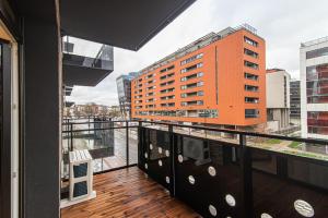 a balcony with a view of a building at #stayhere - New & Stylish Minimalistic 1BDR Vilnius City Center in Vilnius