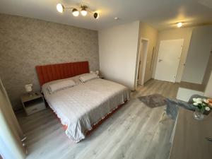 Postel nebo postele na pokoji v ubytování Pensiunea PIRI LAND