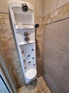a shower stall with a toilet in a bathroom at Twelveon1st in Cape Town