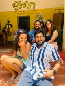 a group of people sitting on a couch at Gaia Hostels in Anjuna