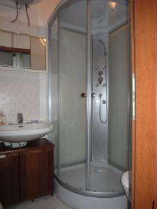 a bathroom with a shower and a sink at Apartment Retro III in Koper +40 photos