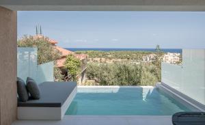 a view of a swimming pool from a house at Nuovo Luxury Suites in Daratso