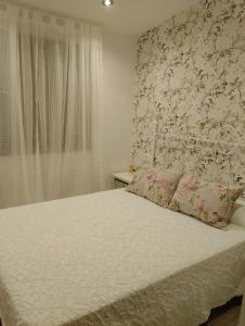 Postel nebo postele na pokoji v ubytování Casa rústica O NOSO VAL