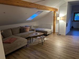 a living room with a couch and a table at Haus Monica in Bodenmais