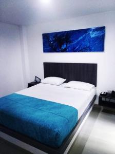 Uma cama ou camas num quarto em Hotel Onix T