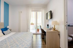 Postel nebo postele na pokoji v ubytování B&B Il Saraceno