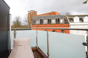 a view of a building from the top of a balcony at STAY Penthouse in Kolding