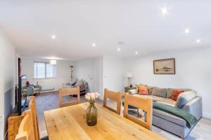 a living room with a couch and a table at Newly Renovated Rural Cottage in North Scarle in Lincoln