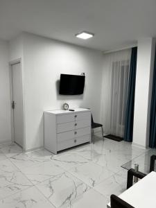 Μια τηλεόραση ή/και κέντρο ψυχαγωγίας στο Cozy place