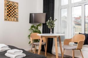 Televízia a/alebo spoločenská miestnosť v ubytovaní NovaNest Apartments - Kalwaryjska - by Upstairs