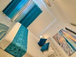 Ένα ή περισσότερα κρεβάτια σε δωμάτιο στο Blue waters at runaway bay
