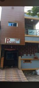 a building with a sign on the side of it at Parvati home stay in Ujjain +21 photos