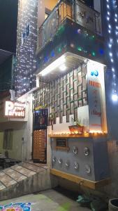 a building with a grill in front of it at Parvati home stay in Ujjain