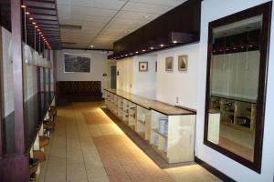 a long hallway with aasteryasteryasteryasteryasteryasteryasteryasteryasteryasteryastery at Days Inn by Wyndham Vermilion in Vermilion