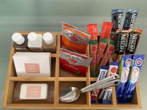 a wooden box with a spoon and other items at The Baobab in Northriding +3 photos