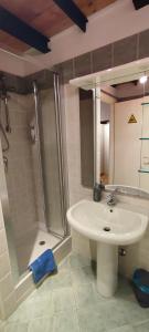 a bathroom with a sink and a shower at la casa di amy - loft corvetto in Milan