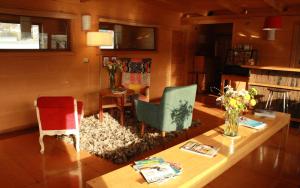 TV a/nebo společenská místnost v ubytování Palafito 1326 Hotel Boutique Chiloé