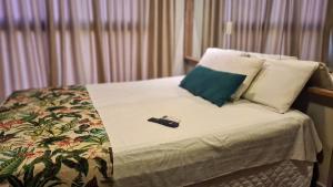 Una cama o camas en una habitación de Uno Flats - By EasyHost 13 fotos más