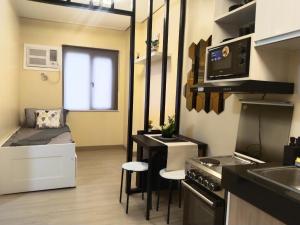 Kuchyň nebo kuchyňský kout v ubytování C516 Place at SMDC Cheer Residences by Lee Portum