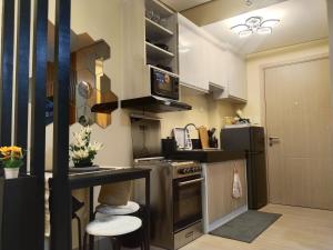 Kuchyň nebo kuchyňský kout v ubytování C516 Place at SMDC Cheer Residences by Lee Portum