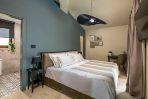a bedroom with a bed and a ceiling fan at Villa Valma by IstriaLux in Svetvinčenat +40 photos