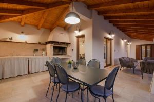 a dining room with a table and chairs at Villa Valma by IstriaLux in Svetvinčenat