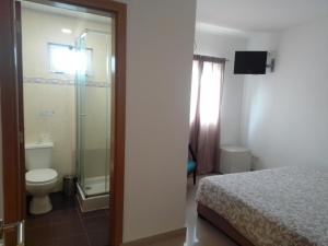 Ein Badezimmer in der Unterkunft Hospedaria U