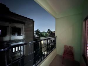 a balcony with a view of a building at Sneha’s Happy Home. in Guwahati