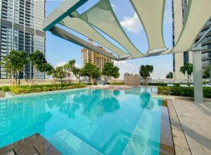 a swimming pool in a building with a building at CitiHome-2BR creek harbour island in Dubai