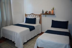 Cama ou camas em um quarto em Hotel Montesilva