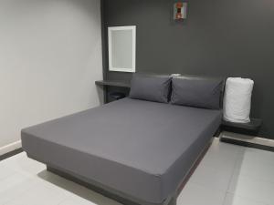 Postel nebo postele na pokoji v ubytování ภูรักษ์รีสอร์ท บ้านกรูด