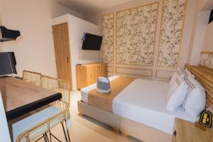 TV a/nebo společenská místnost v ubytování La Casona Hotel Boutique