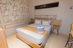 Postel nebo postele na pokoji v ubytování La Casona Hotel Boutique