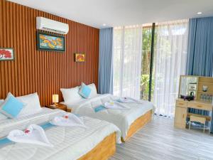 Postel nebo postele na pokoji v ubytování V-Relaxing Resort