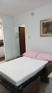 En eller flere senger på et rom på Casa Ricci