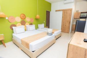 Postel nebo postele na pokoji v ubytování La Casona Hotel Boutique