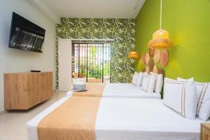 Postel nebo postele na pokoji v ubytování La Casona Hotel Boutique