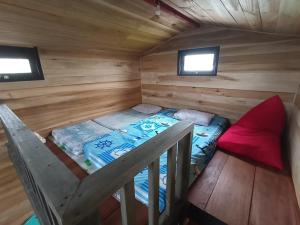 an overhead view of a bed in a wooden cabin at Wawowow in Tomohon +26 photos