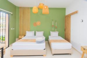 Postel nebo postele na pokoji v ubytování La Casona Hotel Boutique