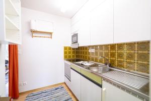 Kuchyň nebo kuchyňský kout v ubytování Feriensiedlung Trü 22 + 8 fotografií
