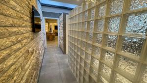 a wall of wine glass panels in a wine cellar at Suites Aix la Chapelle, Exclusive Apartments, Wellness and more, Aachen City in Aachen