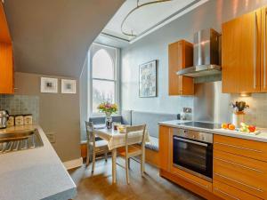 a kitchen with a table and a dining room at 2 bed in Inverness CA328 in Inverness