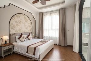 Letto o letti in una camera di Biệt Thự Khởi Nghĩa Bắc Sơn TP Đà Lạt - Gần Chợ và Hồ Xuân Hương