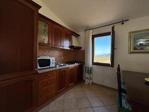 Kuchyň nebo kuchyňský kout v ubytování Hotel I Menhirs
