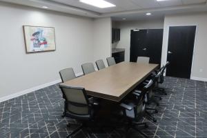 a conference room with a wooden table and chairs at Best Western Prime Inn & Suites in Poteau