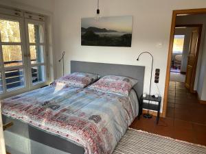 a bedroom with a bed in a room at Ferienwohnung An der Farchauer Mühle in Schmilau